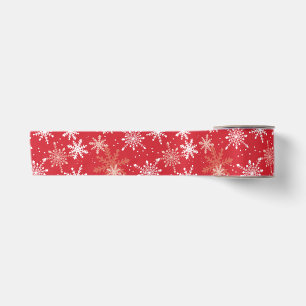 Weißes Schneeflockenmuster auf Rot Satinband
