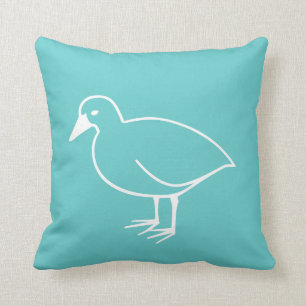 Weißvogel auf aquamarinem, blauem Kissen