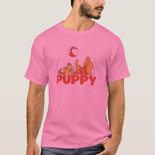 Welpe spielt T-Shirts und Geschenke