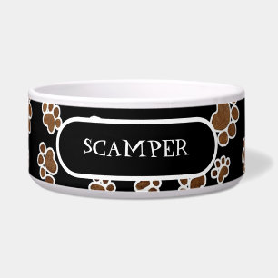 Welpen-Tatzen-Drucke oder große Hundenahrung, die Napf