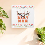 Weltbeste Mama Blume Blumenmüttertag Quadratische Wanduhr<br><div class="desc">Die Blumenmauer-Uhr der niedlichen Blumenwelt ist die beste Blume der Mama. Handgezeichnet Blume in schönen Frühlingsfarben. Geschenk für eine Mutter für Muttertag,  Geburtstag oder Weihnachten. Du kannst Mama zu Mama wechseln,  Mama, ..</div>