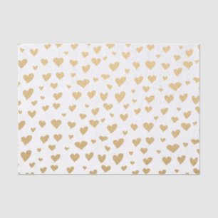 Wenig Goldherzen auf Schneewittchen-Hintergrund Seidenpapier