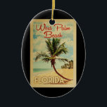 West Palm Beach Palm Tree Vintage Travel Keramik Ornament<br><div class="desc">Ein einzigartiges Retro Mitte des Jahrhunderts moderne West Palm Beach Florida Kunstdrucke im Vintage Reiseplakatstil. Es verfügt über eine geschwungene Palme am Sandstrand mit Ozean unter einem blauen bewölkten Himmel.</div>