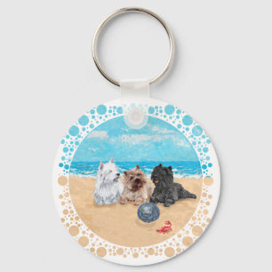 Westie mit Cairn Terriern am Strand Schlüsselanhänger