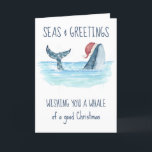 Whale Santa Seas & Greetings Nautische Weihnachten<br><div class="desc">Die Weihnachtskarte des Nautical Spaß ist mit einem Aquarellwal ausgestattet, der eine Weihnachtsmannmütze trägt, die im Meer schwimmt und dessen Schwanz mit Streichlichtern geschmückt ist. Die "Seas & Greetings", "wünscht euch einen Wal von einem guten Weihnachten" und "Happy Holidays" Grüße, zusammen mit dem Namen kann personalisiert sein. Kunst von KL...</div>