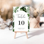 Whimsical Summer Tropical Blätter Script Hochzeit Tischnummer<br><div class="desc">Modernes und elegantes Design gedruckt Whimsical Arch Frame Summer Tropical Blätter Script Wedding Tischnummer, die mit Ihrem Text angepasst werden kann und fügen Sie jede Tischnummer Karte zu Ihrem Warenkorb, eins nach dem anderen. Bitte klicken Sie auf den Button "Anpassen" und verwenden Sie unser Design-Tool, um diese Vorlage zu ändern....</div>