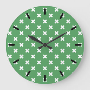White cross stitches on green große wanduhr