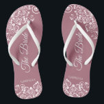 White Lace on Dusty Rose Elegant Bride's Wedding Flip Flops<br><div class="desc">Tanzen Sie die Nacht mit diesen schönen Hochzeitsflip-Flops. Sie sind für die Braut konzipiert und zeichnen sich durch ein schlichtes und dennoch elegantes Design aus. extravagante Schriftzeichen auf einer staubigen Rose oder violett rosa Hintergrund und weiße Spitzen-Gürtel und Wirbel. Eine schöne Art, extravagant und angemessen bleibe, während Sie Ihren Füßen...</div>