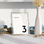 White Modern Bold Wedding Tischnummer Card<br><div class="desc">Das Design der White Modern Bold Wedding Tischnummer Card präsentiert moderne Eleganz und Eleganz. Mit seiner einzigartigen Mischung aus kreativen und schicken Designelementen ist dieses Design perfekt für diejenigen, die eine polierte und kühne Ästhetik an ihrem besonderen Tag suchen. Unsere schicke Off-Set-Typografie fügt Ihrer Hochzeit eine Touch zeitloser Eleganz hinzu,...</div>