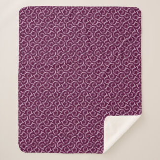 White ornament on a burgundy background. sherpadecke