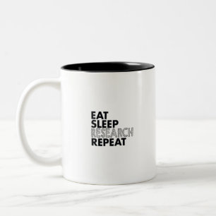 Wiederholung von Essenschlafuntersuchungen Zweifarbige Tasse