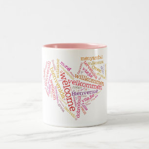 Willkommene Tasse des Herz-(viele Sprachen)