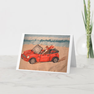 Windhund in rotem Cabrio am Strand Karte