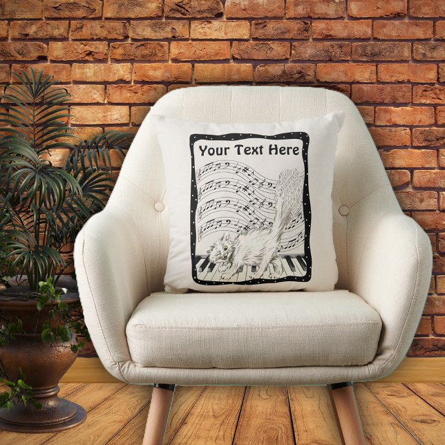 Winking White Cat auf Piano Musiknote Bars Rahmen Kissen (White Winking cat on piano bars of music notes in black and white frame on decorative pillow.)