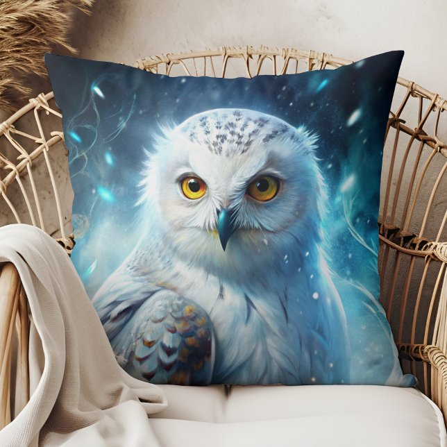 Winter Magic Snowy Owl Mystic Blue Throw Pillow Kissen (Winter Magic Snowy Owl Mystic Blue Throw Pillow in a boho rattan armchair.)