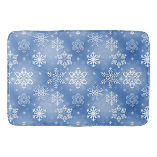 Winter-Schneeflocken auf eisigem Blau Badematte