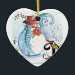 WINTERSERENADE VON SNOWMAN UND PENGUIN KERAMIKORNAMENT<br><div class="desc">Whimsikale,  farbenfrohe,  pastellfarbene Malerei in blauen Rottönen,  Schneemann und Pinguin im Winterschnee mit roten Blume, Schnörkel.von Bulgan Lumini (c)</div>