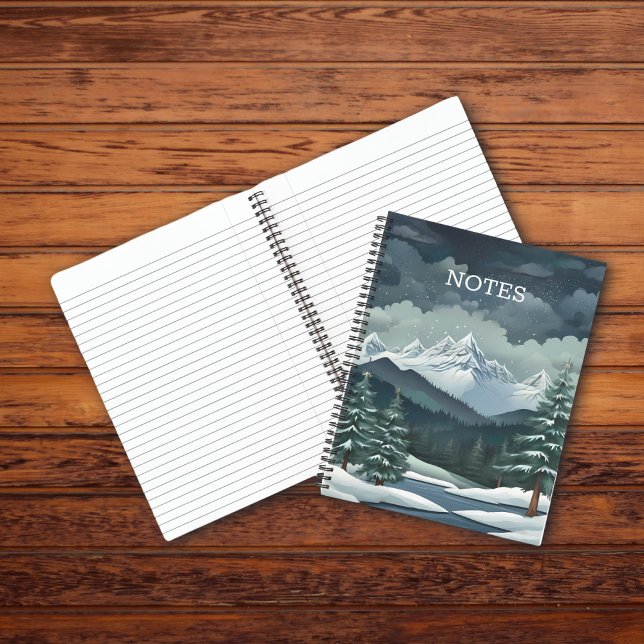 Winterwaldgebirgslandschaft personalisierbar notizbuch (Winter Forest mountain notebook with lined pages on a wooden table.)