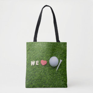 Wir Liebe Golf mit Golfball und Tee auf grünem Gr