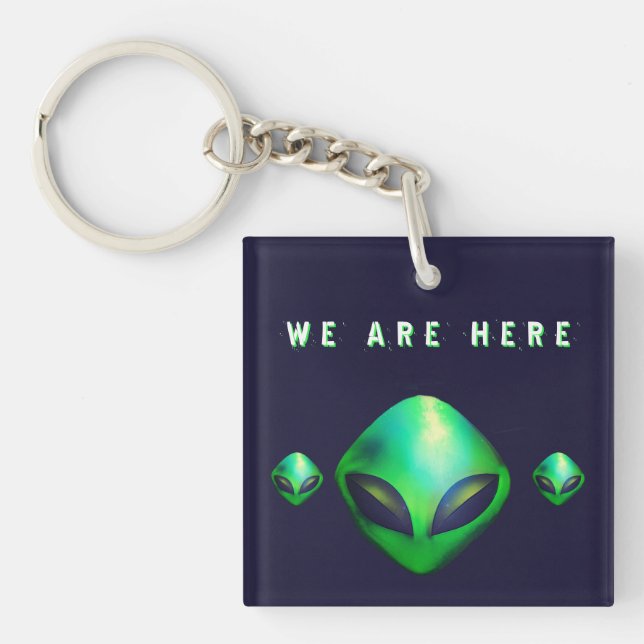 "Wir sind hier" grüner Alien-Kopf Schlüsselanhänger (Vorderseite)