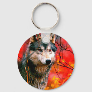 Wolf guckt durch Blätter in einem Wald Schlüsselanhänger