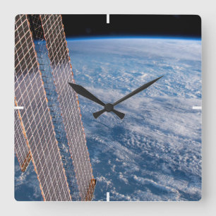 Wolkenkratzer- und Korallenmeere. Quadratische Wanduhr