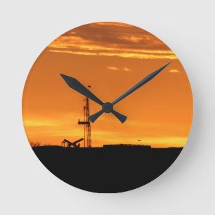Workover Rig bei Sunset Runde Wanduhr