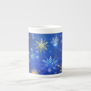 XMAS Blue Background mit goldenen Schneeflocken Prozellantasse
