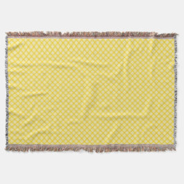 Yellow and gray patterned blanket with fringed decke