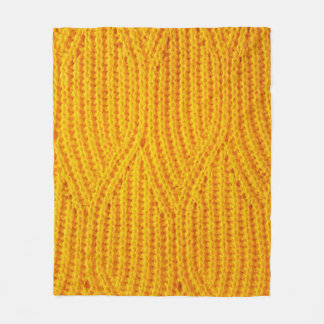Yellow knitted surface textile material background fleecedecke
