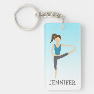 Yoga-Mädchen in der erweiterten Hand-zu-Zehen-Pose Schlüsselanhänger