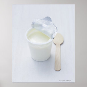 Yoghurt in opened disposable cup poster