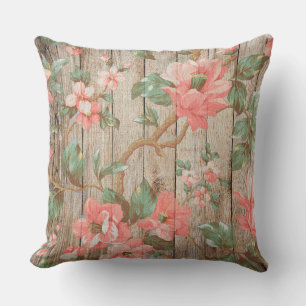 Zarte Vintage-Rosa-Blumen mit grünen Blättern auf Kissen