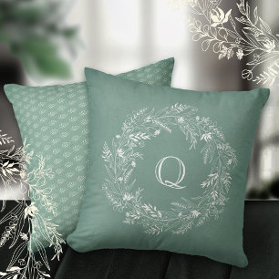 Zarter botanischer Grünring Buchstabe Q Kissen