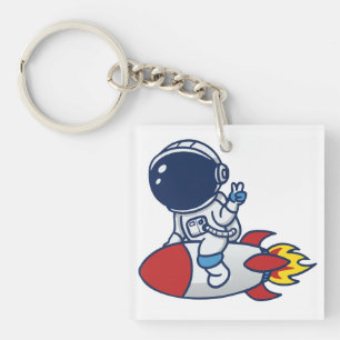 Zeichnung eines Cartoon-Astronauten auf einer Rake Schlüsselanhänger