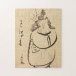 Zen Classics - Gibon Sengai - Tenmangu Puzzle<br><div class="desc">Dieses einzigartige Zen-Puzzle ist mit einem Pinselstrich inspiriert, der von Gibons "Tenmangu"-Figur. Das ausdrucksvolle Pinselwerk und der minimalistische Stil spiegeln sowohl den Spaß als auch die spirituelle Tiefe der japanischen Zen-Kunst wider. Eine meditative Aktivität, die Achtsamkeit mit jedem Stück einlädt. **Dieses Kunstwerk basiert auf "Tenmangu" Gibon Sengai. Discover mehr Japan...</div>