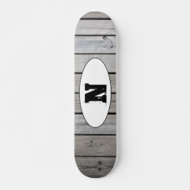 Zerfallenes Grunge-Holzkörnmonogramm Skateboard