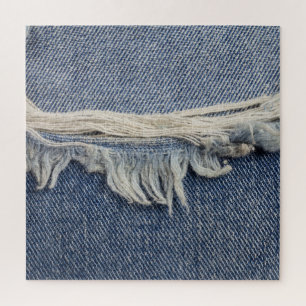 Zerrissene Jeans-Textur, stilvoller Hintergrund. Puzzle