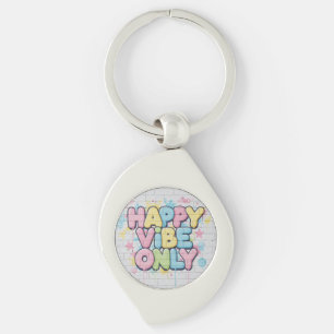Ziegel mit farbenfrohem Text, der „Happy Vibe Only Schlüsselanhänger