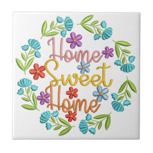 Zitat 'Home Sweet Home' mit bunter Blumenumrandung Fliese