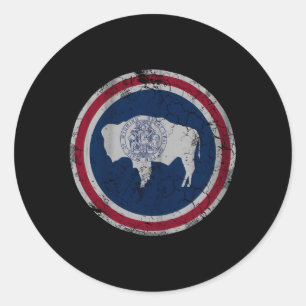 Zuhause der Wyoming Flag-Familie verblasst. Runder Aufkleber