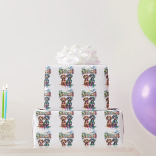 Zwei farbenfrohe Dachshunde auf einem europäischen Geschenkpapier