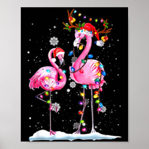 Zwei Flamingos mit Weihnachtsmannmütze und Lichter Poster