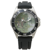 Zwei Frauen fischen auf dem Gras am Fluss