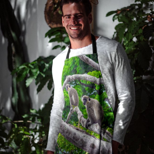 Zwei grüne Affen, die in der Schürze Baumdruck sit (Von Creator hochgeladen)