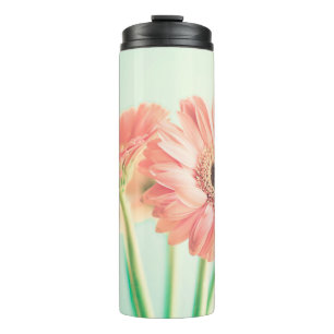 Zwei palepinfarbene Blume Thermosbecher