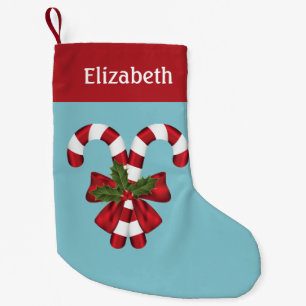 Zwei rote und weiße Candy Canes auf Blau mit Namen Kleiner Weihnachtsstrumpf