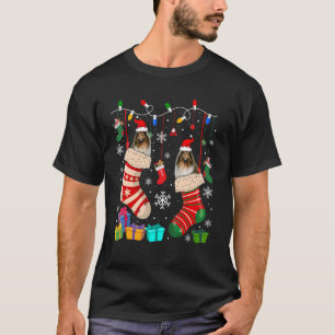 Zwei Santa-Shetland-Schäferhunde in Weihnachts-Soc T-Shirt