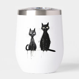 Zwei schwarze Katzen