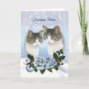 Zwei Weihnachtskatzen mit Schneeeis und blauen Ros Feiertagskarte